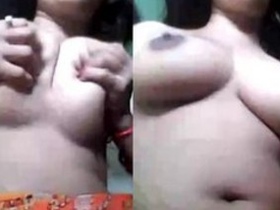 Watch a stunning bhabi flaunt her breasts and pleasure herself