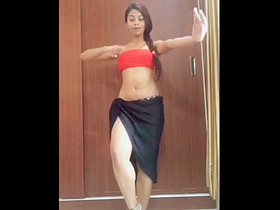 Seductive brunette bombshell shows off her legs in dance routine