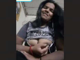 Video of South Asian woman revealing her large breasts
