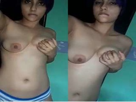 Exclusive cute girl teases with her boobs on camera