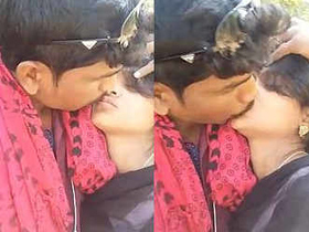 Outdoor kissing between Indian lovers
