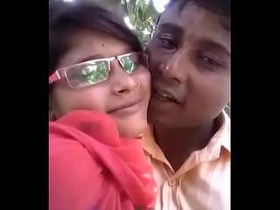 Indian sweethearts share a passionate kiss outdoors