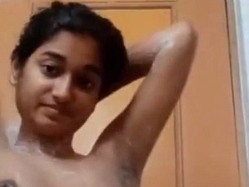 Naked Indian teen takes a bathroom selfie