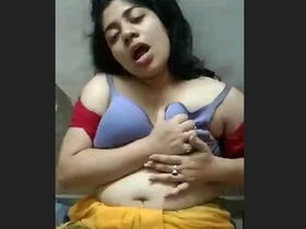 Bhabhi's husband passionately caresses her breasts while making love