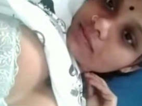 A Tamil girl flaunts her large breasts in a video