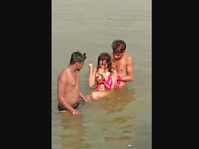 A young woman from a rural community has a pleasant experience with two men near a body of water.