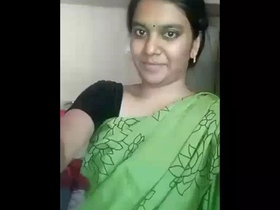 A busty Indian wife showcases her allure in a provocative saree