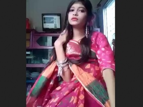 A pretty Indian girl wearing a smooth saree