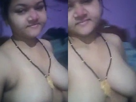 Desi housewife's self-shot video featuring her large and droopy breasts
