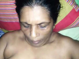 Elder woman performs a hand job and receives semen on her breasts