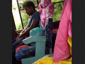 Tarki guy pleasures himself on the bus, aware that nearby girls are filming him