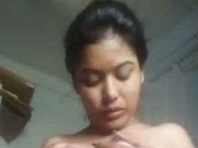 Watch a stunning Indian girl in a solo video, showing off her big boobs