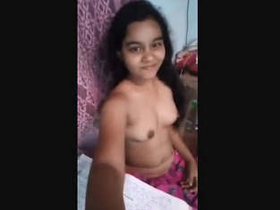Indian beauty reveals her naked form playfully