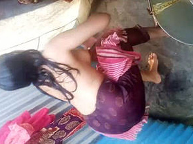 Desi girl enjoys shower in village