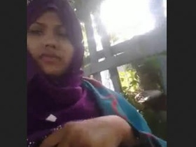 Romantic outdoor date between hijabi girl and boyfriend