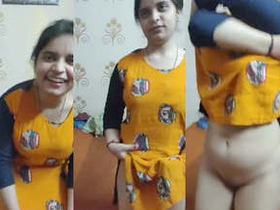 Lingerie-clad housewife undresses to reveal her curves